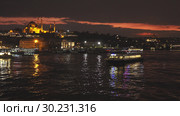 Istanbul night cityscape with looking over Golden Horn to Suleymaniye Mosque on a twilight dramatic sky. 4K UHD video, 3840, 2160p. Стоковое фото, фотограф Ярослав Данильченко / Фотобанк Лори