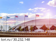 Russia, Samara, June 2018: national flags, countries participating in the World Cup, against the backdrop of the stadium. Редакционное фото, фотограф Акиньшин Владимир / Фотобанк Лори
