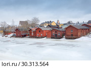 A view of old wooden barns in the Porvoo Old Town, Finland (2019 год). Редакционное фото, фотограф Ольга Визави / Фотобанк Лори
