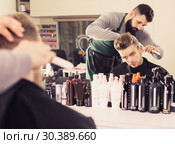 Client looking displeased about new haircut. Стоковое фото, фотограф Яков Филимонов / Фотобанк Лори