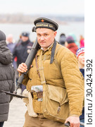 Russia Samara November 2018: Historical reconstruction of the battle of the Second World War. Portrait of a Russian soldier. Редакционное фото, фотограф Акиньшин Владимир / Фотобанк Лори