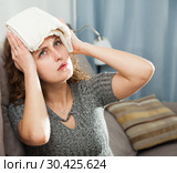 Woman with wet towel on her forehead. Стоковое фото, фотограф Яков Филимонов / Фотобанк Лори