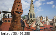 Magical rooftop of Palau Guell with chimneys and central spire designed by architect Antoni Gaudi (2018 год). Редакционное видео, видеограф Яков Филимонов / Фотобанк Лори