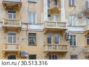 The old Soviet multystoried building with balconies, Krasnooktyabrsky district, Volgograd (2019 год). Редакционное фото, фотограф Владимир Арсентьев / Фотобанк Лори