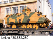 Wrecked armored combat vehicle of terrorists on a railway flatcar (2019 год). Редакционное фото, фотограф Евгений Харитонов / Фотобанк Лори