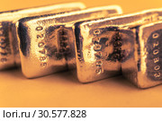 Precious shiny gold bars. Background for finance banking concept. Trade precious metals. Bullions. Стоковое фото, фотограф bashta / Фотобанк Лори