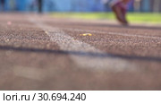 Blurred background of walking people on stadium. Amateur sport footage slowmo. Стоковое видео, видеограф Dmitry Domashenko / Фотобанк Лори