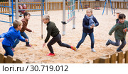 Smiling children playing romp game Touch-last. Стоковое фото, фотограф Яков Филимонов / Фотобанк Лори