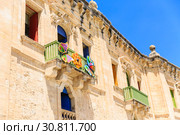 beautiful baroque building with bright doors and shutters built with sandstone (2019 год). Стоковое фото, фотограф Ирина Мойсеева / Фотобанк Лори