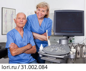 Qualified doctors near modern ultrasound machine. Стоковое фото, фотограф Яков Филимонов / Фотобанк Лори