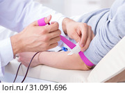 Patient getting blood transfusion in hospital clinic. Стоковое фото, фотограф Elnur / Фотобанк Лори