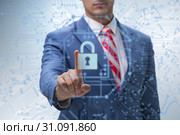 Man in digital security concept pressing button. Стоковое фото, фотограф Elnur / Фотобанк Лори