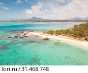Aerial view of beautiful tropical beach with turquoise sea. Tropical vacation paradise destination of D'eau Douce and Ile aux Cerfs Mauritius. Стоковое фото, фотограф Matej Kastelic / Фотобанк Лори