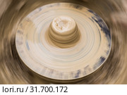 Rotating potter's wheel with a wad of clay. Стоковое фото, фотограф Евгений Харитонов / Фотобанк Лори