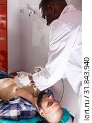 Rescue team making defibrillation to patient. Стоковое фото, фотограф Яков Филимонов / Фотобанк Лори