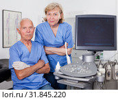 Qualified doctors near modern ultrasound machine. Стоковое фото, фотограф Яков Филимонов / Фотобанк Лори