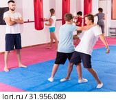 Kids practicing in pair self-protection. Стоковое фото, фотограф Яков Филимонов / Фотобанк Лори