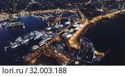 View from drone of illuminated Barceloneta beach with Port Vell t night (2019 год). Стоковое видео, видеограф Яков Филимонов / Фотобанк Лори