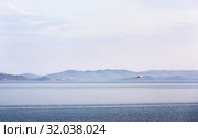 Amphibian aircraft during refueling by water to extinguish forest fires in Irkutsk Region. Lake Baikal. Стоковое фото, фотограф Юлия Батурина / Фотобанк Лори