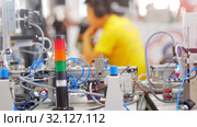 Modern technological exhibition - a man working with an equipment on a background. Стоковое видео, видеограф Константин Шишкин / Фотобанк Лори