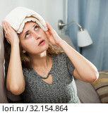 Female holding compress on her head. Стоковое фото, фотограф Яков Филимонов / Фотобанк Лори