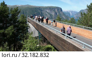 Spectacular Stegastein viewing platform above Aurlandsfjord. It is located on national tourist route Aurlandsfjellet. It is build with front class wall. Norway (2019 год). Редакционное видео, видеограф Кекяляйнен Андрей / Фотобанк Лори