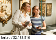 Girl with woman looking with interest at art objects in museum. Стоковое фото, фотограф Яков Филимонов / Фотобанк Лори