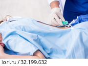 Female patient getting an injection in the clinic. Стоковое фото, фотограф Elnur / Фотобанк Лори