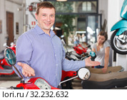 Smiling man is standing satisfied. Стоковое фото, фотограф Яков Филимонов / Фотобанк Лори