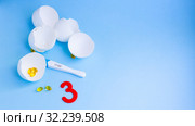 Long-awaited pregnancy after unsuccessful IVF. Positive pregnancy test, pills, eggshell. Стоковое фото, фотограф Papoyan Irina / Фотобанк Лори