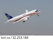 30 AUGUST 2019 MOSCOW, RUSSIA: A passenger plane flying in the overcast sky - SUKHOI SUPERJET100. Редакционное фото, фотограф Константин Шишкин / Фотобанк Лори