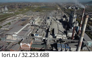 Компания HeidelbergCement. Завод по производству сухих строительных смесей. Вид с воздуха. HeidelbergCement. Plant for the production of dry mixes. Aerial view. Стоковое видео, видеограф Евгений Романов / Фотобанк Лори