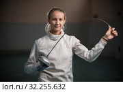 A portrait of a young smiling woman fencer bending a singlestick. Стоковое фото, фотограф Константин Шишкин / Фотобанк Лори