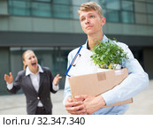 Serious man is standing upset near office. Стоковое фото, фотограф Яков Филимонов / Фотобанк Лори
