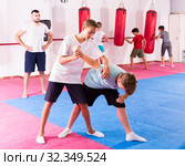 Kids practicing in pair self-protection. Стоковое фото, фотограф Яков Филимонов / Фотобанк Лори