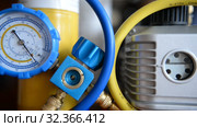 HVAC Repair Close-Up Vacuum pump, pressure gauge, manifold for Repair and Installation of refrigerators, air conditioners, ventilation, heating. Стоковое видео, видеограф Mikhail Erguine / Фотобанк Лори