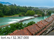 Bern, Switzerland - August 07, 2019: Beautiful landscape of Bern with old bridge. Bern is capital of Switzerland and fourth most populous city. Редакционное фото, фотограф Григорий Стоякин / Фотобанк Лори