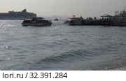Life boats of luxury cruise liner Norwegian Jewel transportation travelers and tourists from ship and forth in Petropavlovsk-Kamchatsky Sea Port (2018 год). Редакционное видео, видеограф А. А. Пирагис / Фотобанк Лори