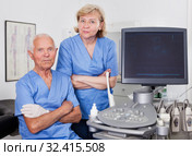 Qualified doctors near modern ultrasound machine. Стоковое фото, фотограф Яков Филимонов / Фотобанк Лори