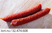 Appetizing tyrolean sausages on wooden table. Стоковое фото, фотограф Яков Филимонов / Фотобанк Лори