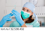 Professional nurse young woman making injection in hospital. Стоковое фото, фотограф Яков Филимонов / Фотобанк Лори