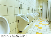 urinals in the public in a modern toilet. Стоковое фото, фотограф Акиньшин Владимир / Фотобанк Лори