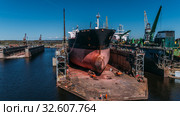 Tanker vessel repair in dry dock Shipyard, Drone shot. Стоковое фото, фотограф Aleksejs Bergmanis / Фотобанк Лори