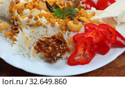 Алу Пядж Чаначур с рисом и пикули из манго. Стоковое фото, фотограф Марина Володько / Фотобанк Лори