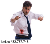 Wounded businessman with blood stains isolated on white backgrou. Стоковое фото, фотограф Elnur / Фотобанк Лори