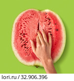 Woman's finger touch inside watermelon ripe juicy fruit. Стоковое фото, фотограф Ярослав Данильченко / Фотобанк Лори