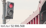 Slow motion Traffic light above the road regulates the road. Close-up change the traffic lights. Traffic regulations and driving safety. Semaphore fixed on metal pole. Semaphore in industry. Стоковое видео, видеограф Сергей Тимофеев / Фотобанк Лори