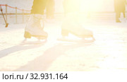 A woman skating on ice rink outdoors - slowing down. Стоковое видео, видеограф Константин Шишкин / Фотобанк Лори