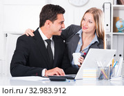 Businesswoman seducing male colleague. Стоковое фото, фотограф Яков Филимонов / Фотобанк Лори