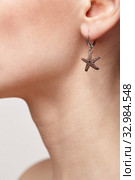 Beautiful woman with galvanic earring in form of small starfish. Стоковое фото, фотограф Сергей Пристяжнюк (Serg Zastavkin) / Фотобанк Лори